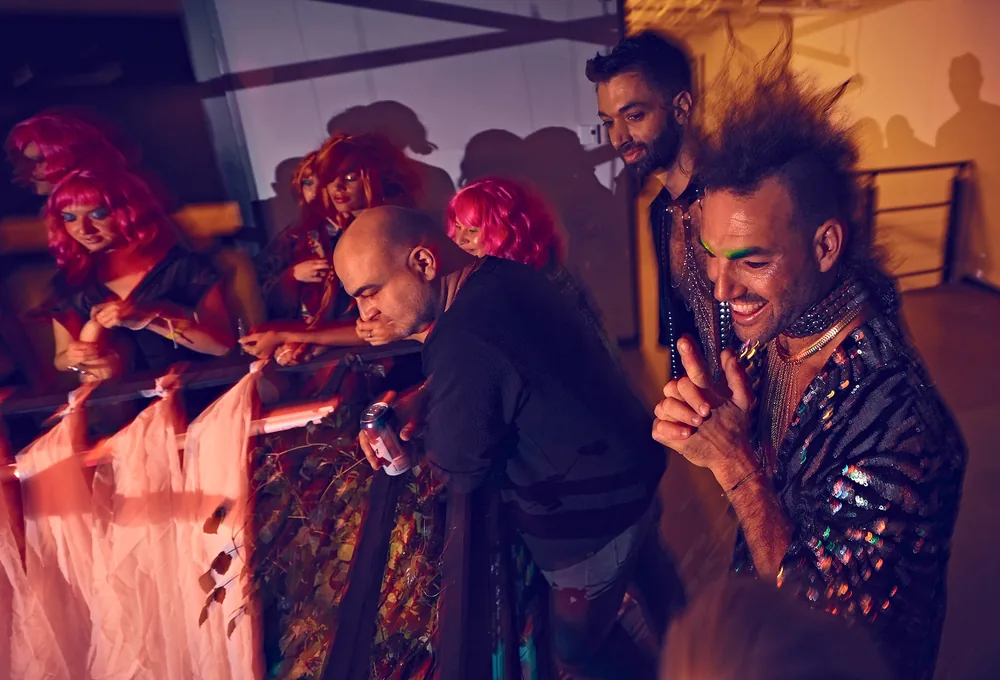 Sylvain Brochu dresses the models before the show