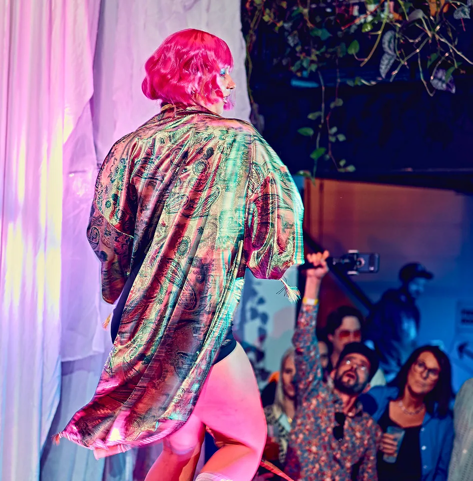 Printed robe seen from behind, facing the audience